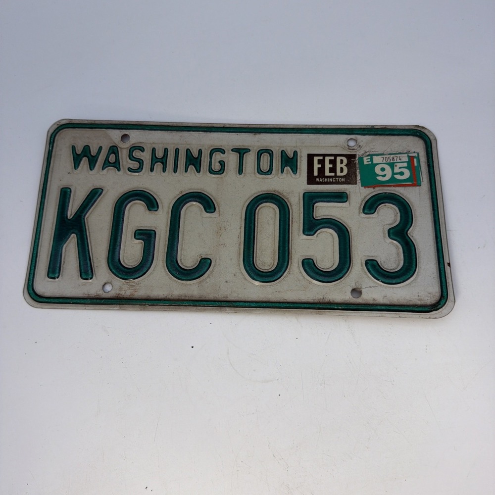 green-and-white Washington State license plate KGC 053